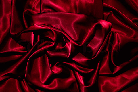 Texture of a red silk closeup