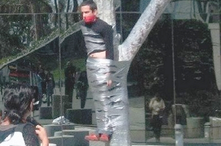 crazy-man-tied-to-tree_01