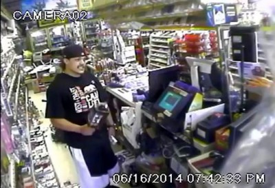 Thug Throws Bottles Of Liquor At Clerk During Robbery